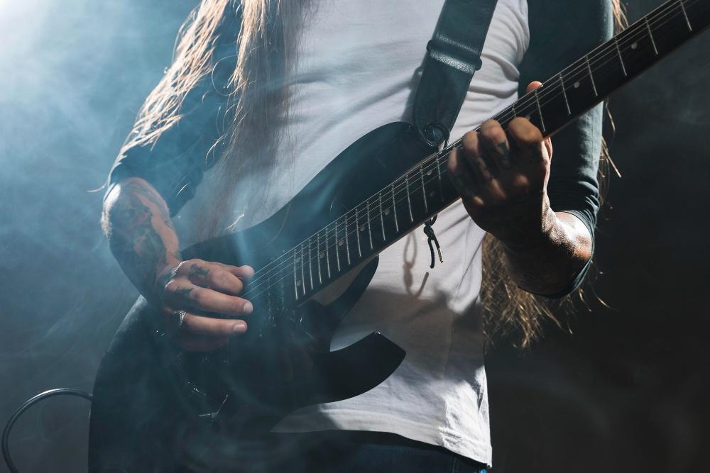 https://www.freepik.com/free-photo/artist-playing-guitar-medium-shot_11107861.htm#fromView=search&page=1&position=0&uuid=681a874b-2dc5-4fbf-ba89-3e1cd8034bbe