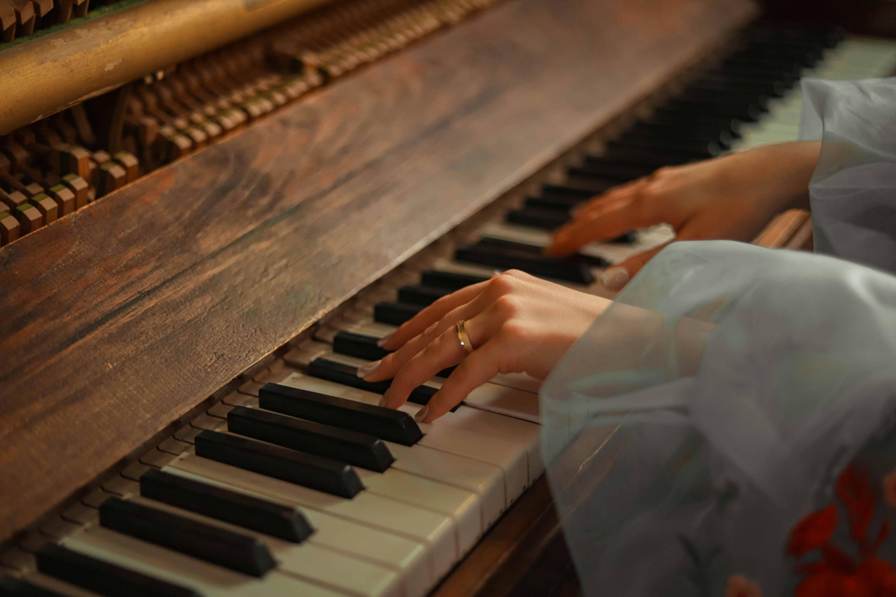 https://unsplash.com/photos/a-close-up-of-a-person-playing-a-piano-gVTkF7Nahd4